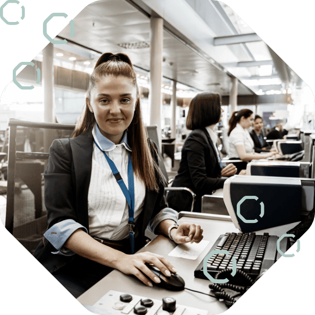 Woman at computer desk planning airport operations and resource allocation